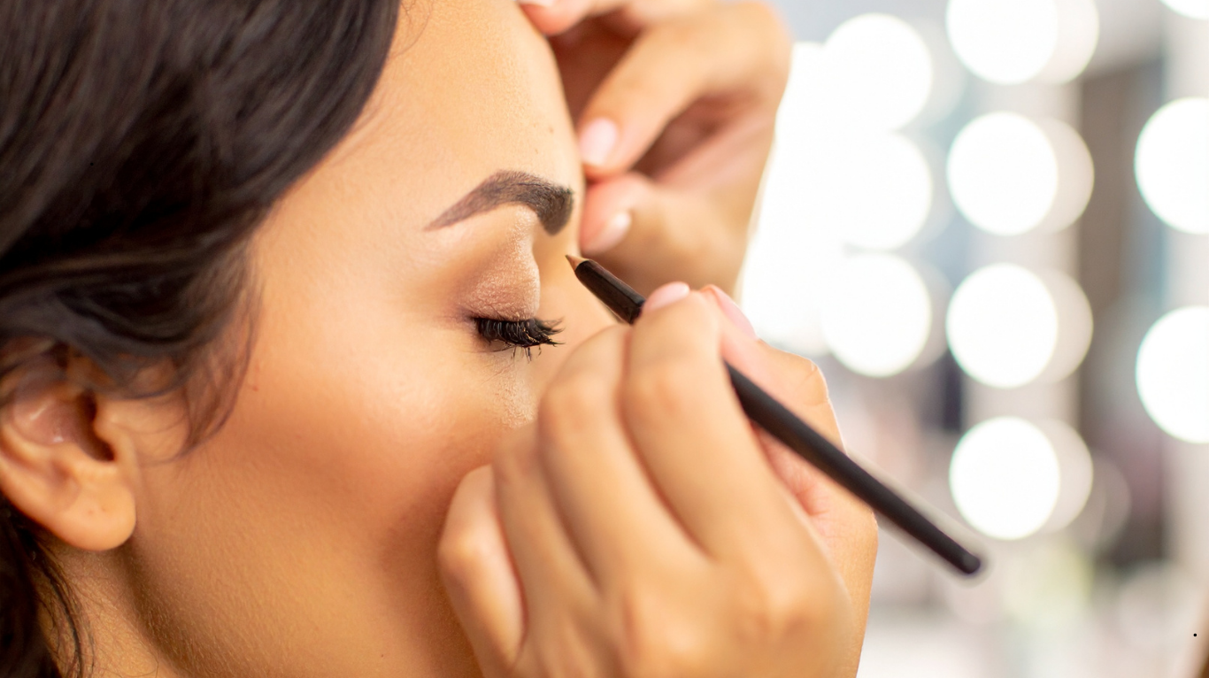 Makeup artist creating a flawless bridal look using premium products