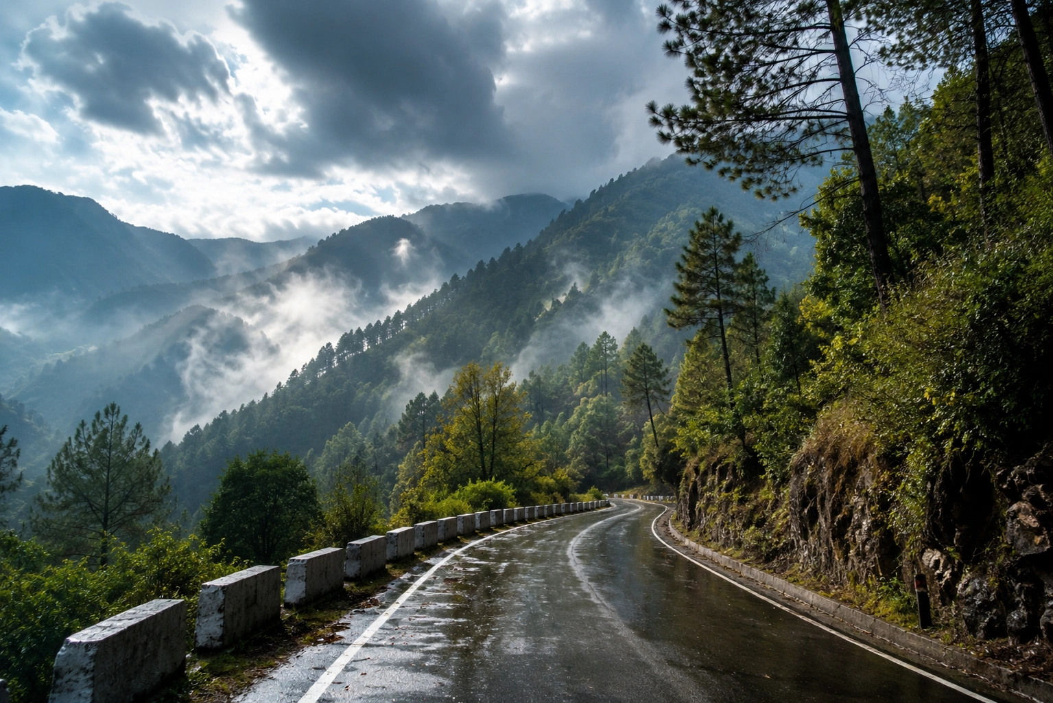 A peaceful mountain road surrounded by green hills, trees and changing weather conditions during a scenic hill journey.