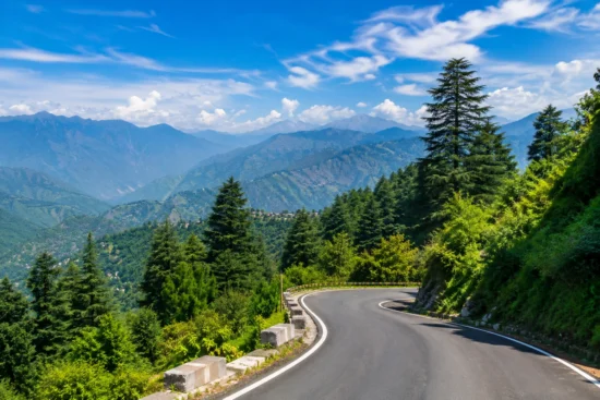 Best time to go Mussoorie for enjoying scenic mountain roads surrounded by green hills, trees and distant views.